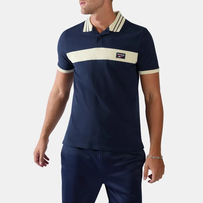 REEBOK APPAREL MEN Heritage Paneled Piqué Polo Shirt VECTOR NAVY/LINEN made by Reebok