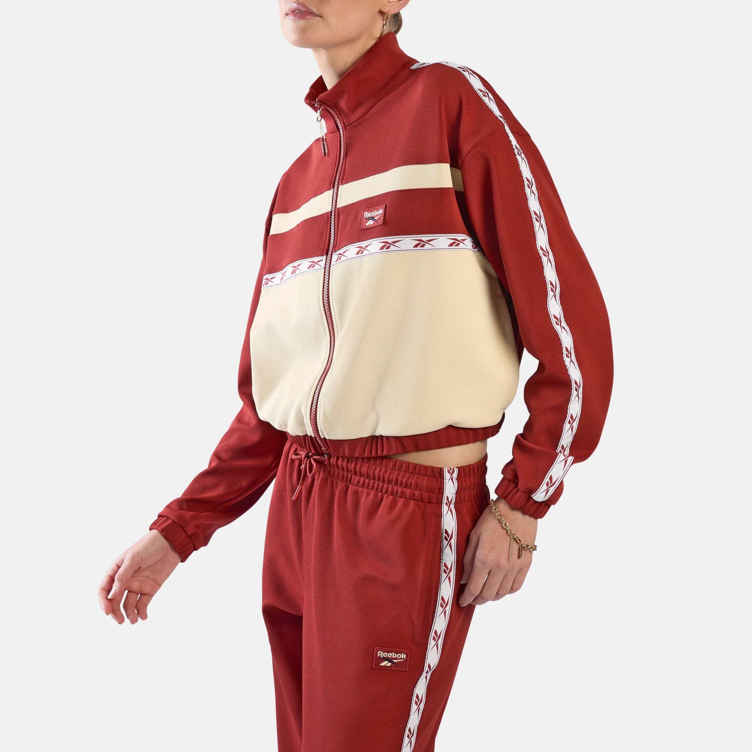 REEBOK APPAREL WOMEN Heritage Taped Track Jacket HERITAGE RED/LINEN sold by Reebok
