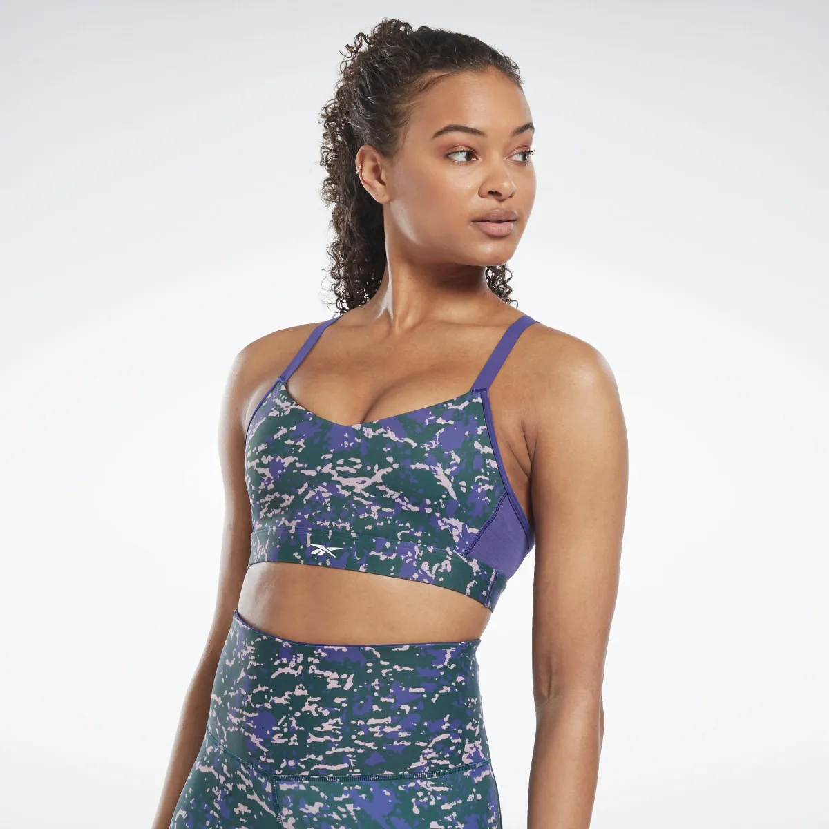 Reebok Apparel Women Lux Speckle Modern Safari Strappy Bra Forgrn sold by Reebok