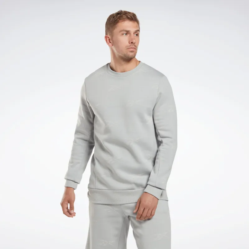 Reebok Apparel Men Reebok Identity Vector Fleece Crew Sweatshirt Pugry3 sold by Reebok