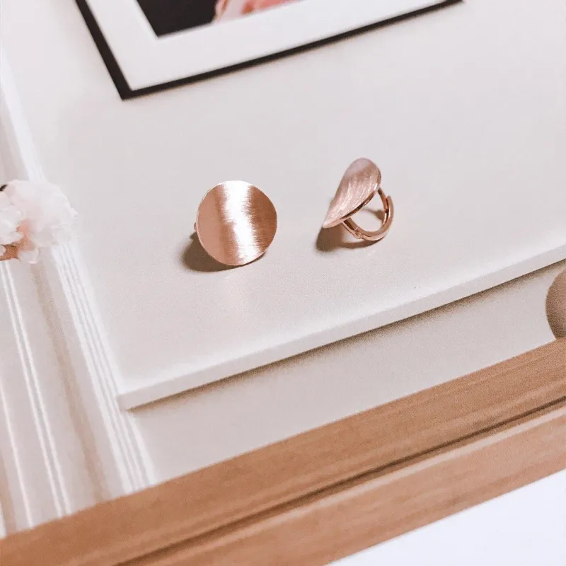 Circle huggie earrings sold by NABI LONDON