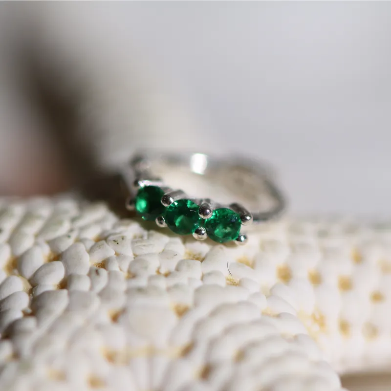 Triple gemstone huggie earring sold by NABI LONDON