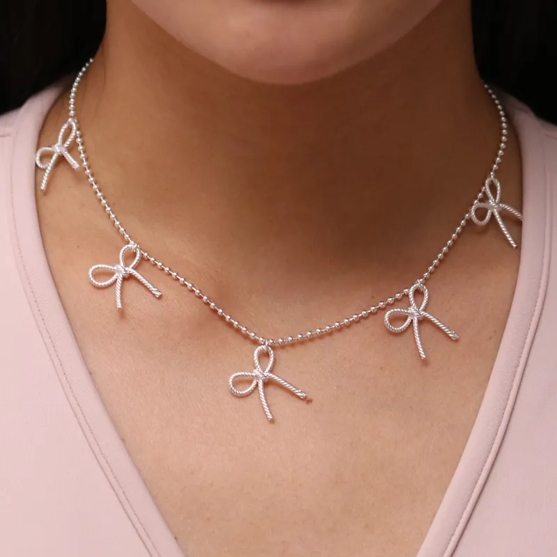 Bow necklace sold by NABI LONDON
