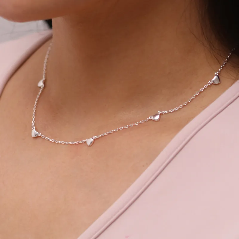 Hearts charm necklace sold by NABI LONDON