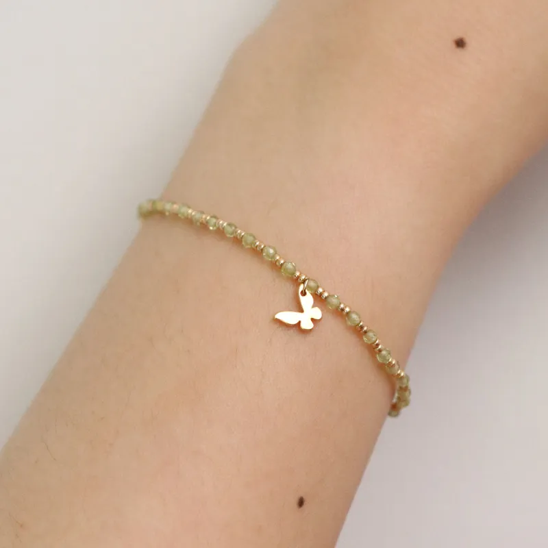 Gemstone butterfly charm bracelet sold by NABI LONDON