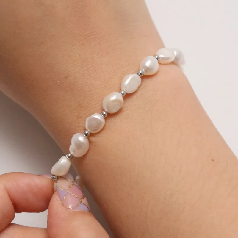 Freshwater pearl stretched bracelets sold by NABI LONDON