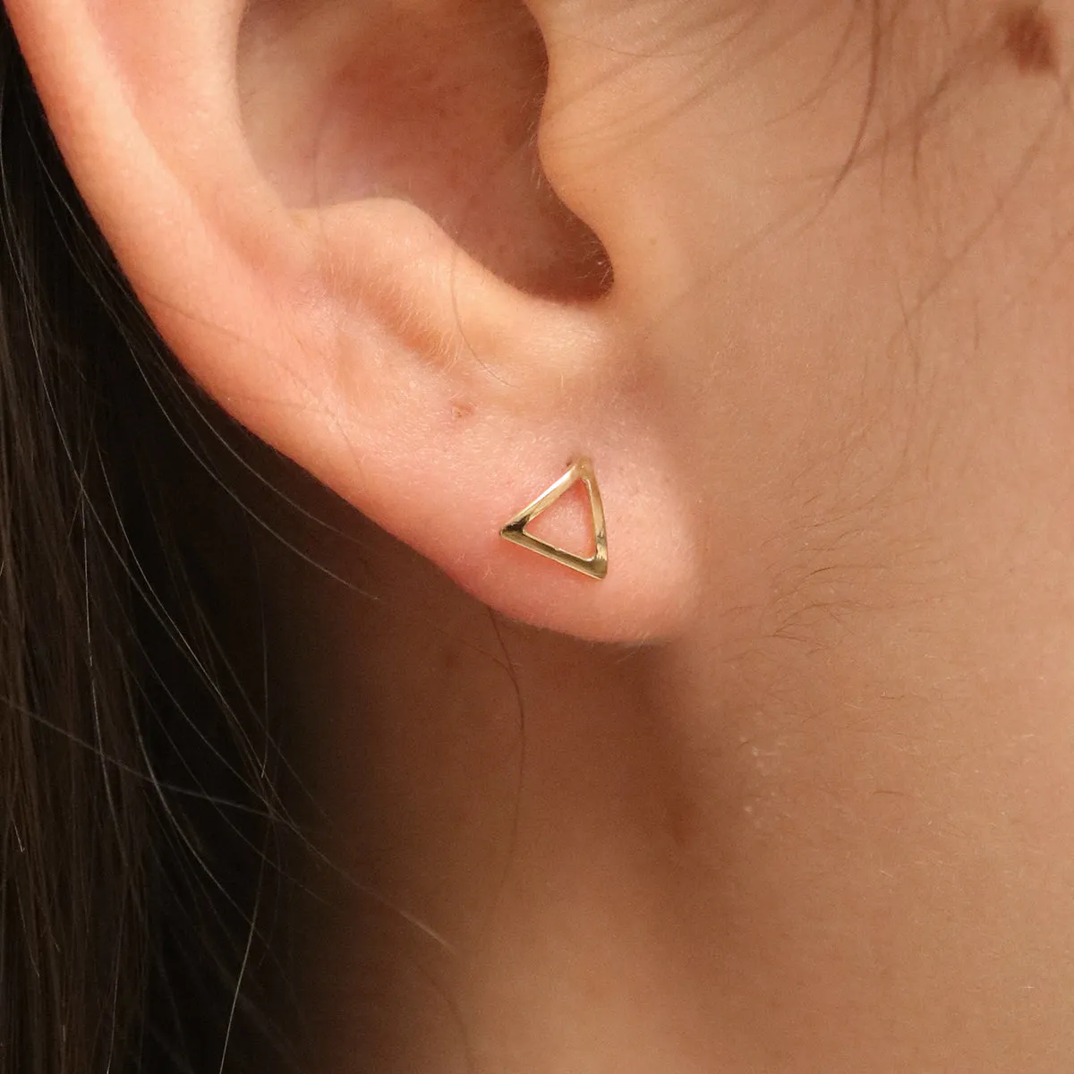 Simple triangle studs sold by NABI LONDON product image thumbnail 3