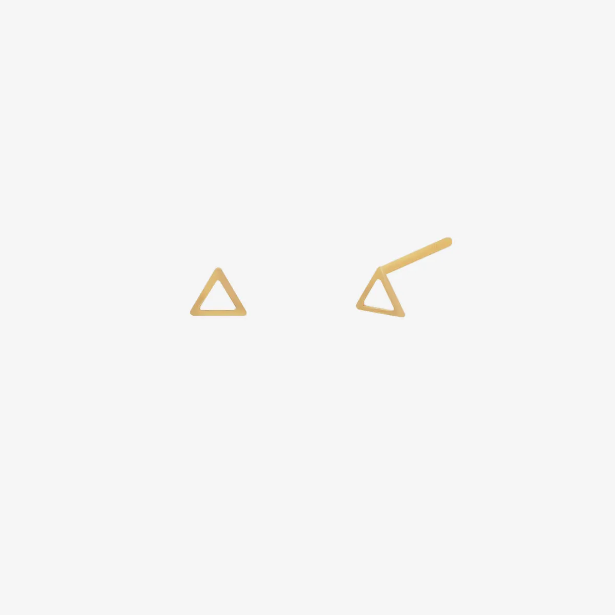 Simple triangle studs sold by NABI LONDON