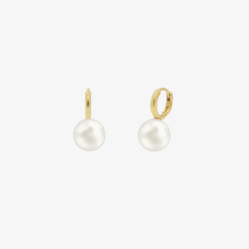 Pearl drop huggie earrings sold by NABI LONDON