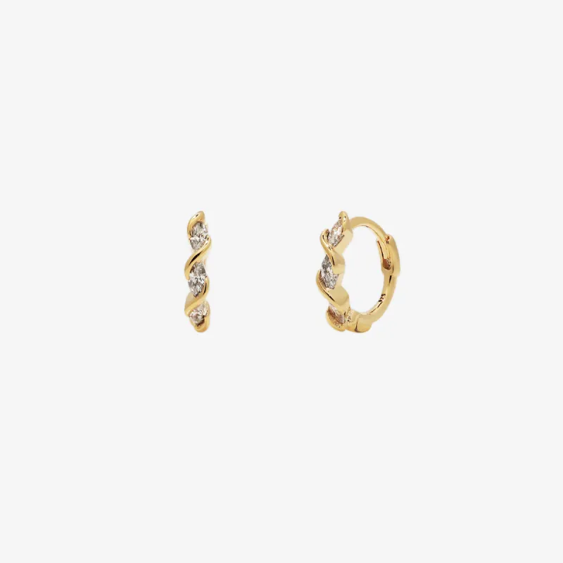 White Topaz Twirl Huggie Earrings sold by NABI LONDON