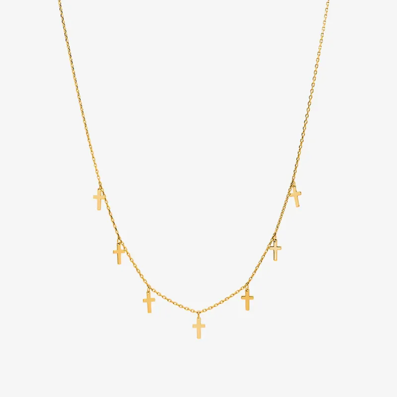 Cross charm necklace sold by NABI LONDON