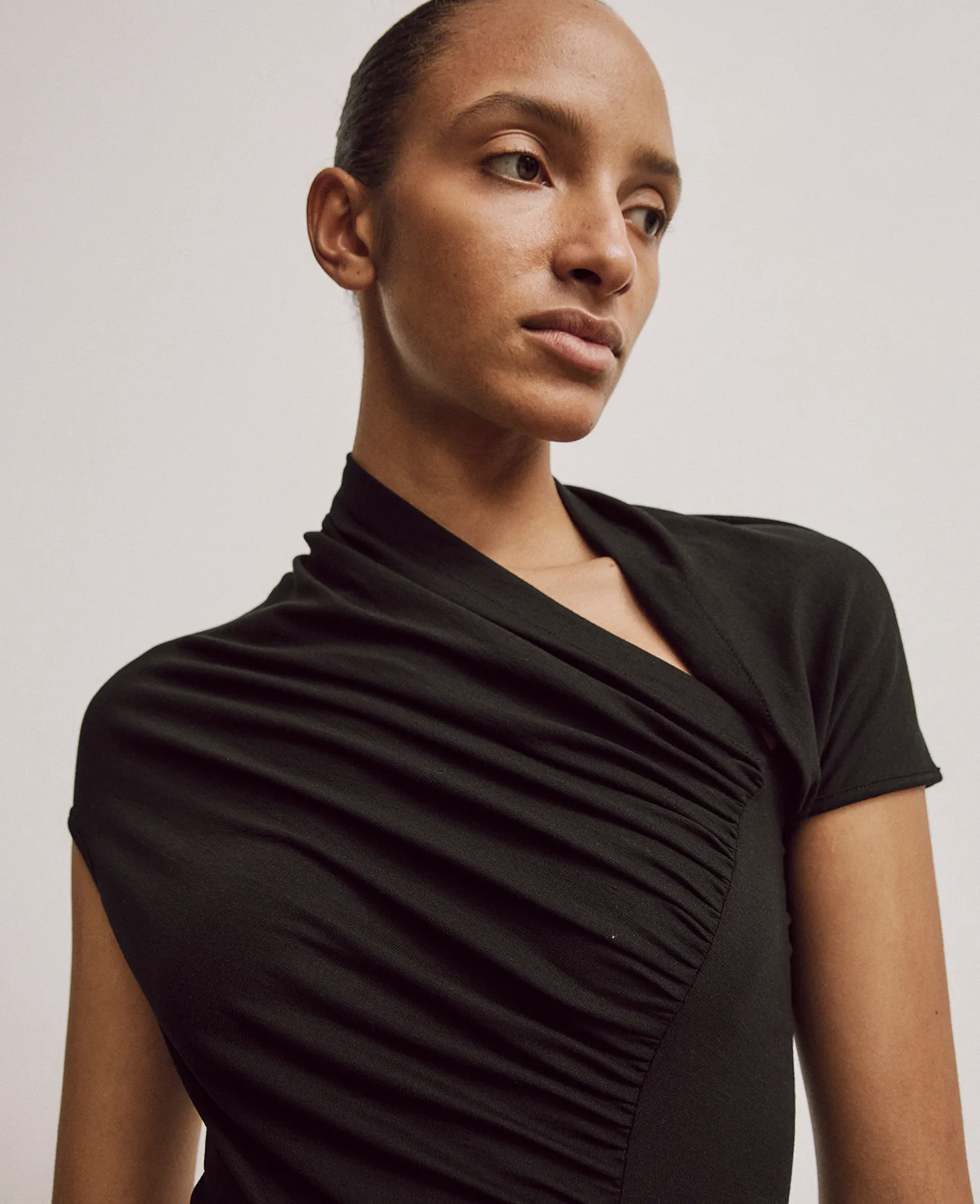 Scarab Micromodal Cut Out Top in Black sold by Ninety Percent