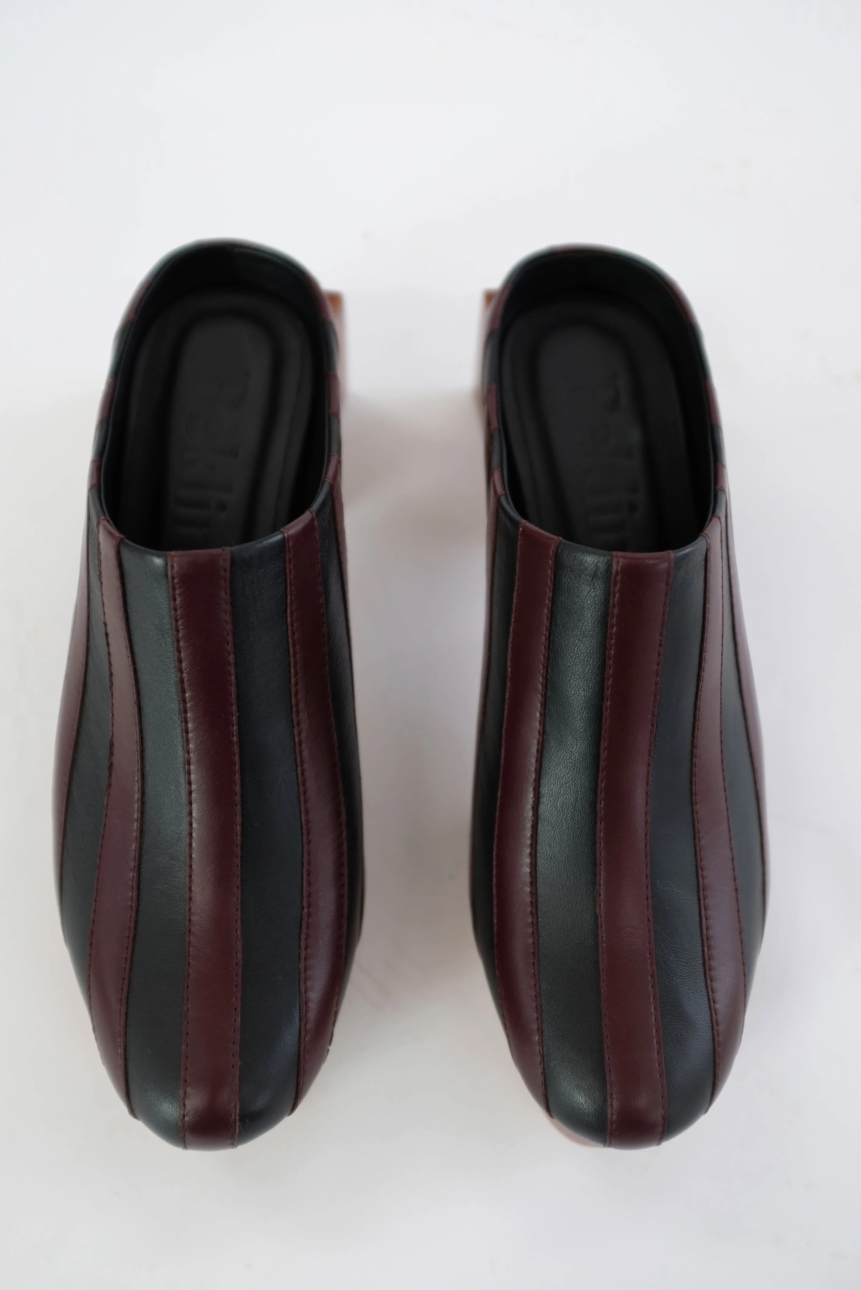 Beklina Matisse Platform Mules Black/Umber sold by Beklina