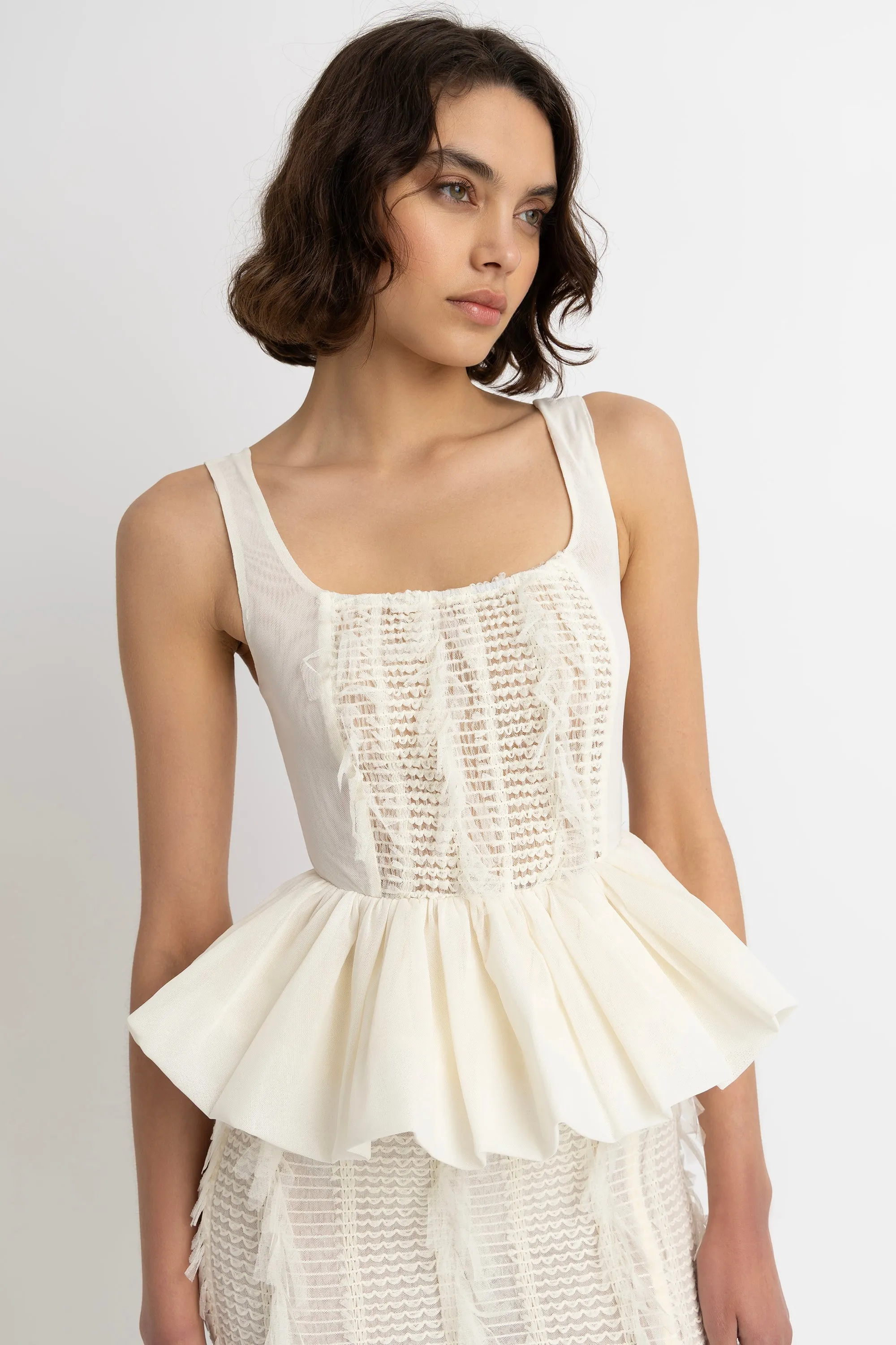 Calla Ivory Peplum Top sold by AMYLYNN
