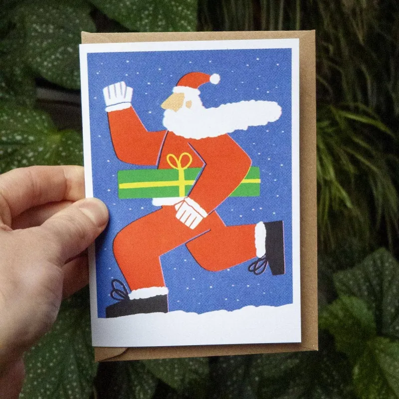 Running Santa Christmas Card: Blue made by Masato Jones