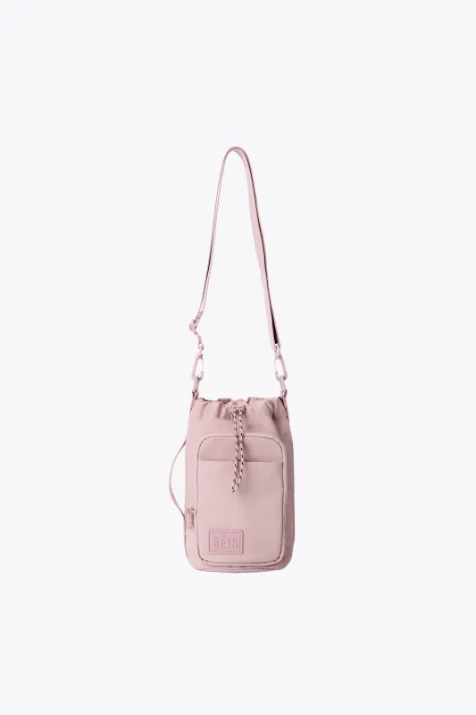 The Magnetic Water Bottle Sling in Atlas Pink sold by Beis