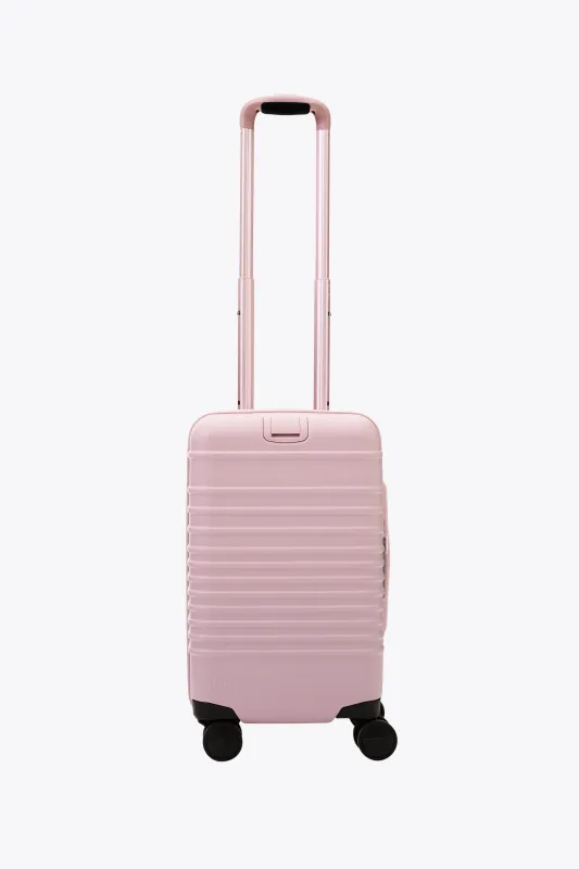 The Small Carry-On Roller in Atlas Pink sold by Beis