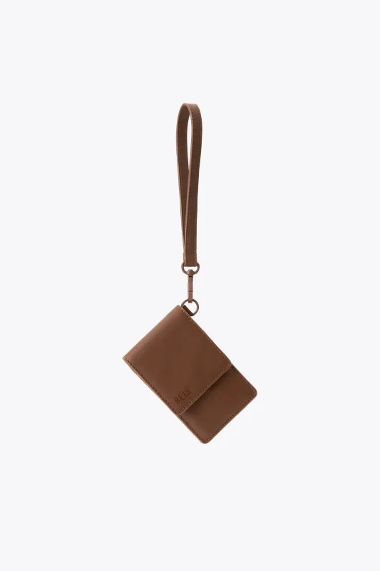 The ID Wristlet in Maple sold by Beis