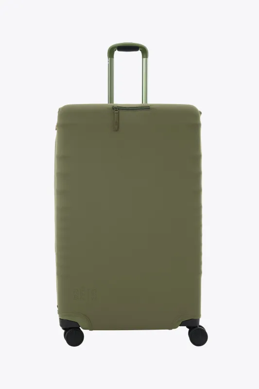 The Large Check-In Luggage Cover in Olive sold by Beis