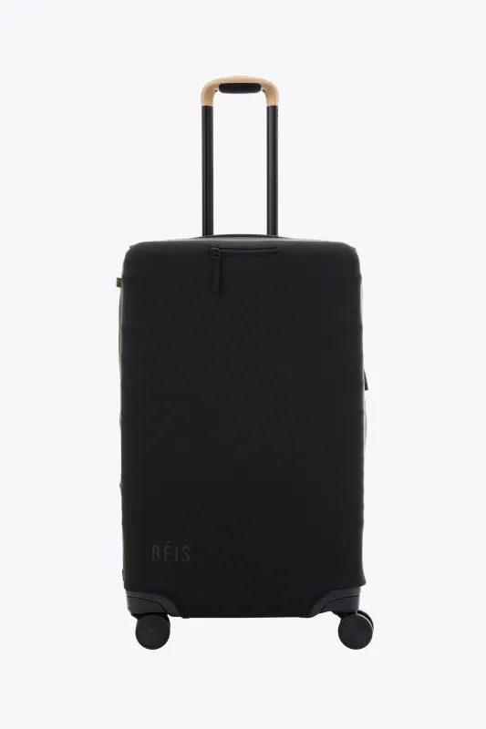 The Medium Check-In Luggage Cover in Black sold by Beis