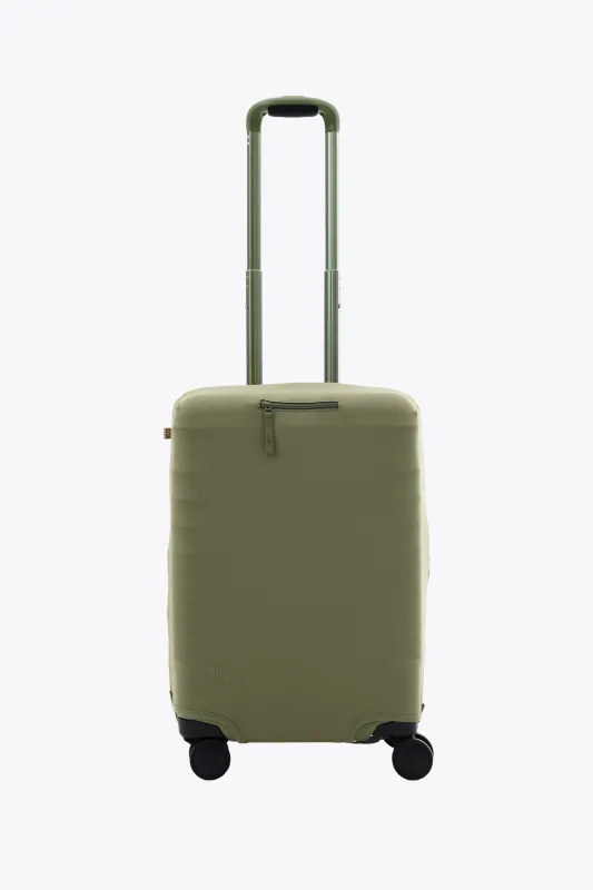 The Carry-On Luggage Cover in Olive sold by Beis