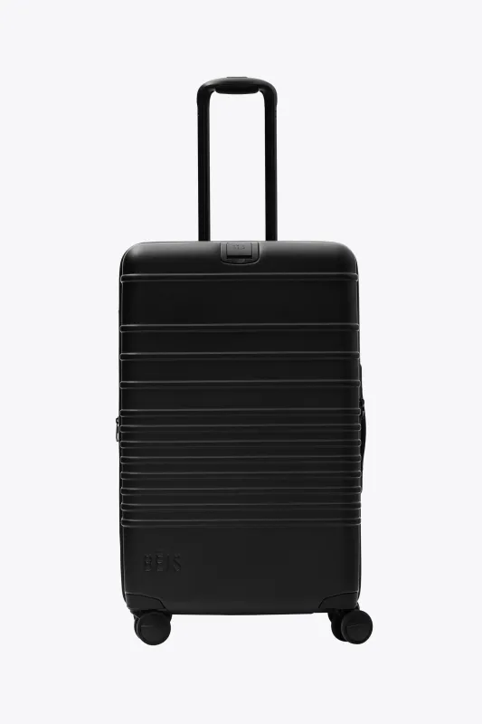 The Medium Check-In Roller in All Black sold by Beis