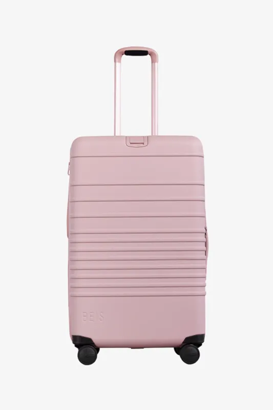 The Medium Check-In Roller in Atlas Pink sold by Beis