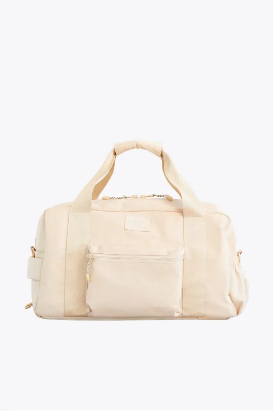 The Sport Duffle Backpack in Beige sold by Beis