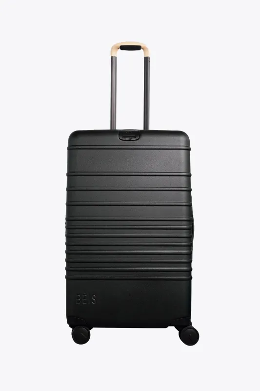 The Medium Check-In Roller in Black sold by Beis