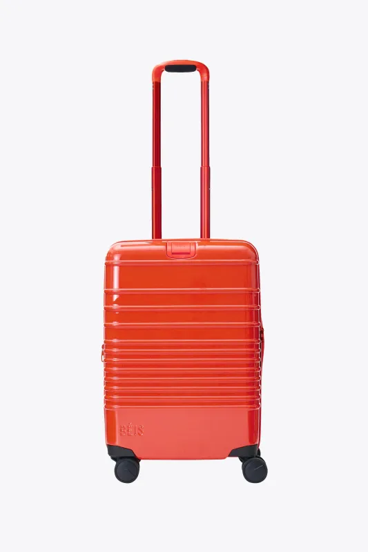 The Carry-On Roller in Glossy Flame sold by Beis