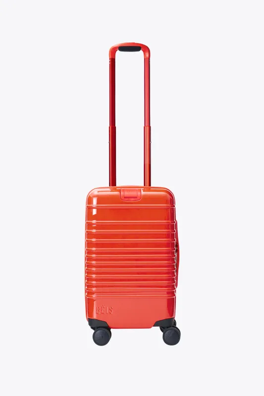 The Small Carry-On Roller in Glossy Flame made by Beis