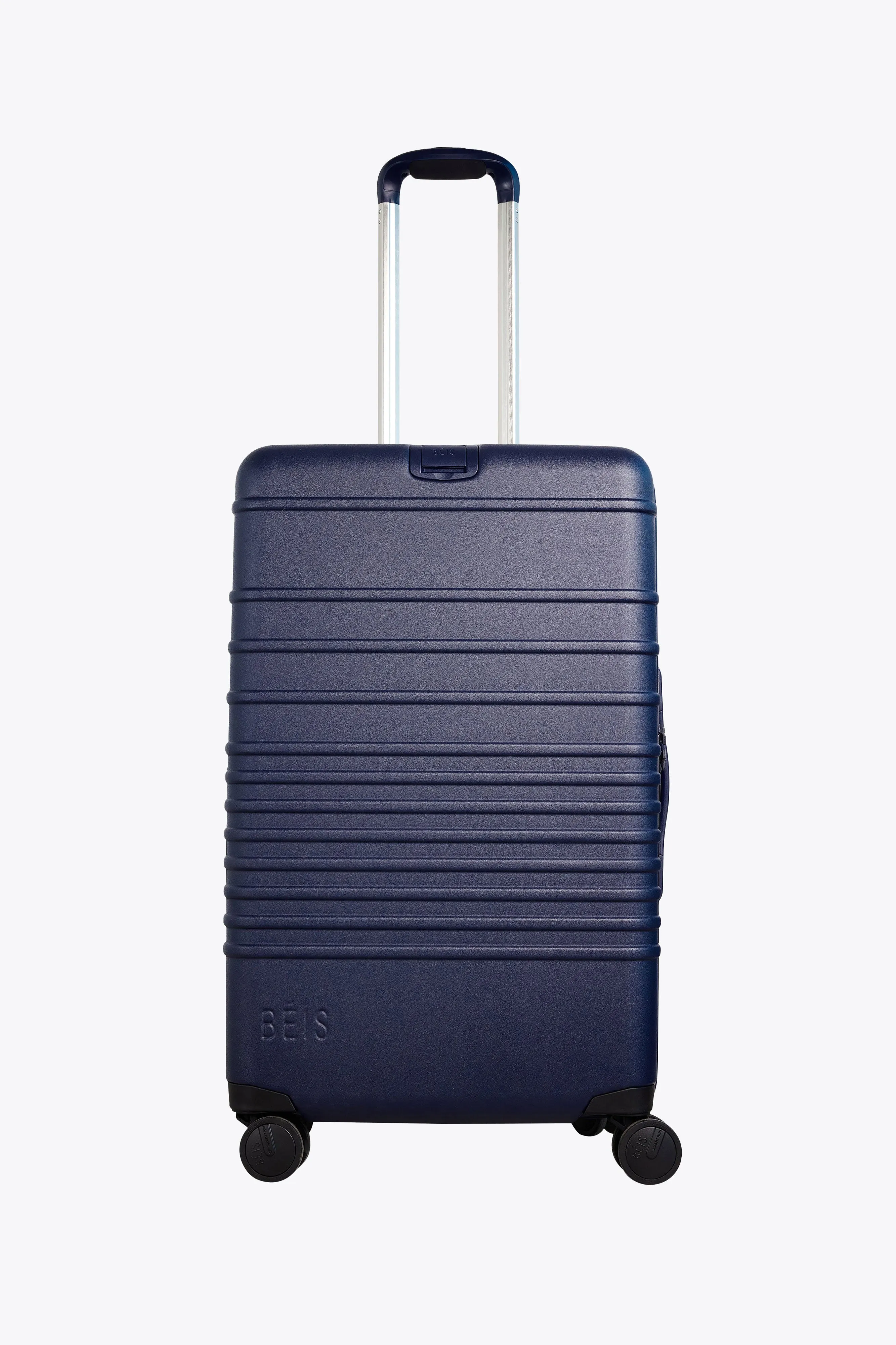 The Medium Check-In Roller in Navy sold by Beis