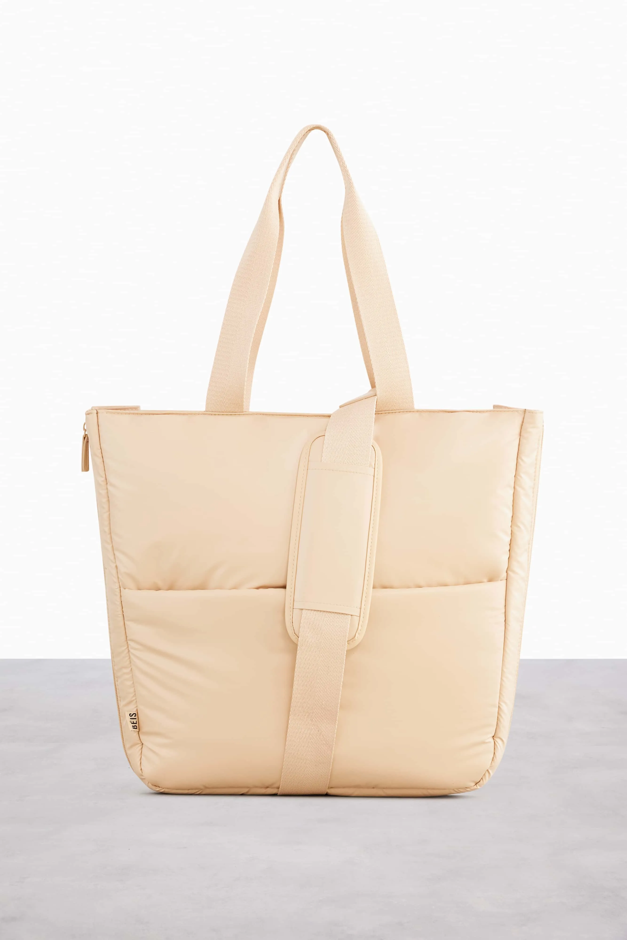 The Expandable Tote in Beige sold by Beis