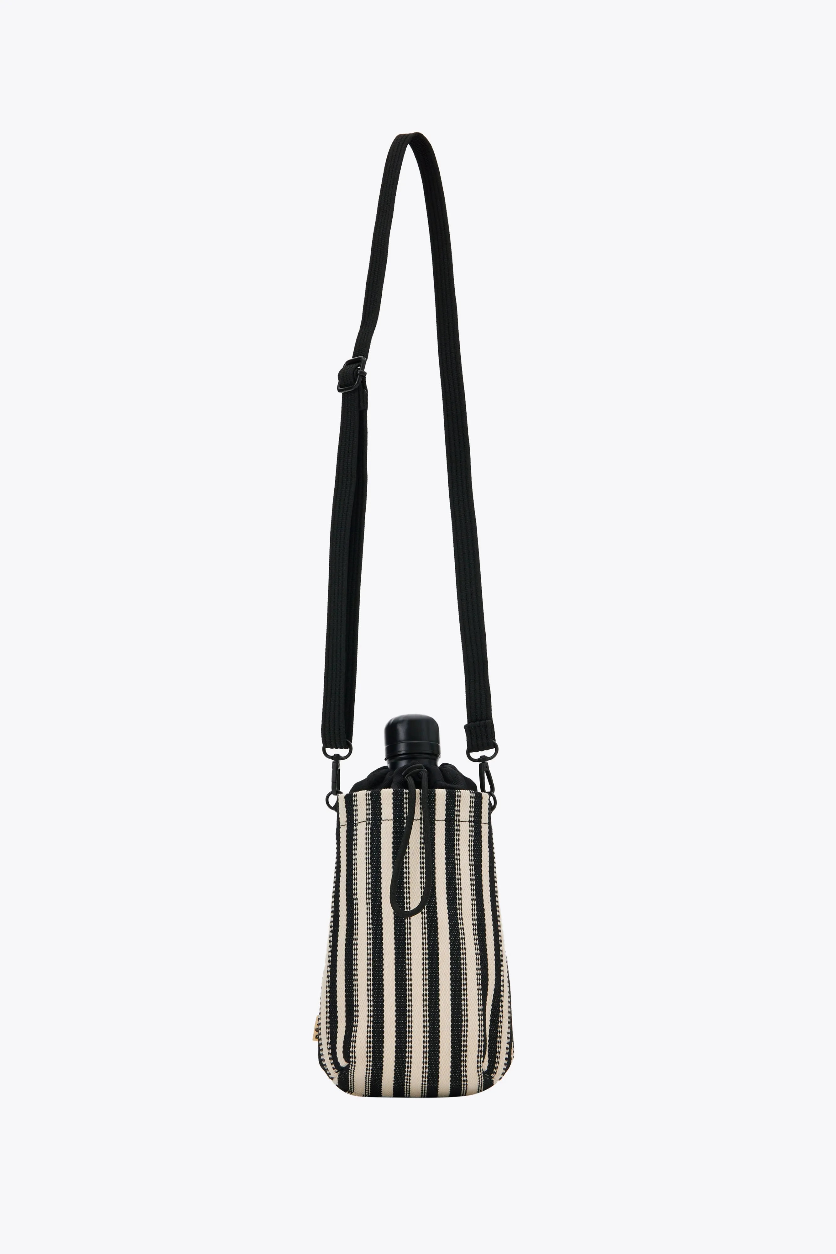 The Water Bottle Crossbody in Black Stripe sold by Beis