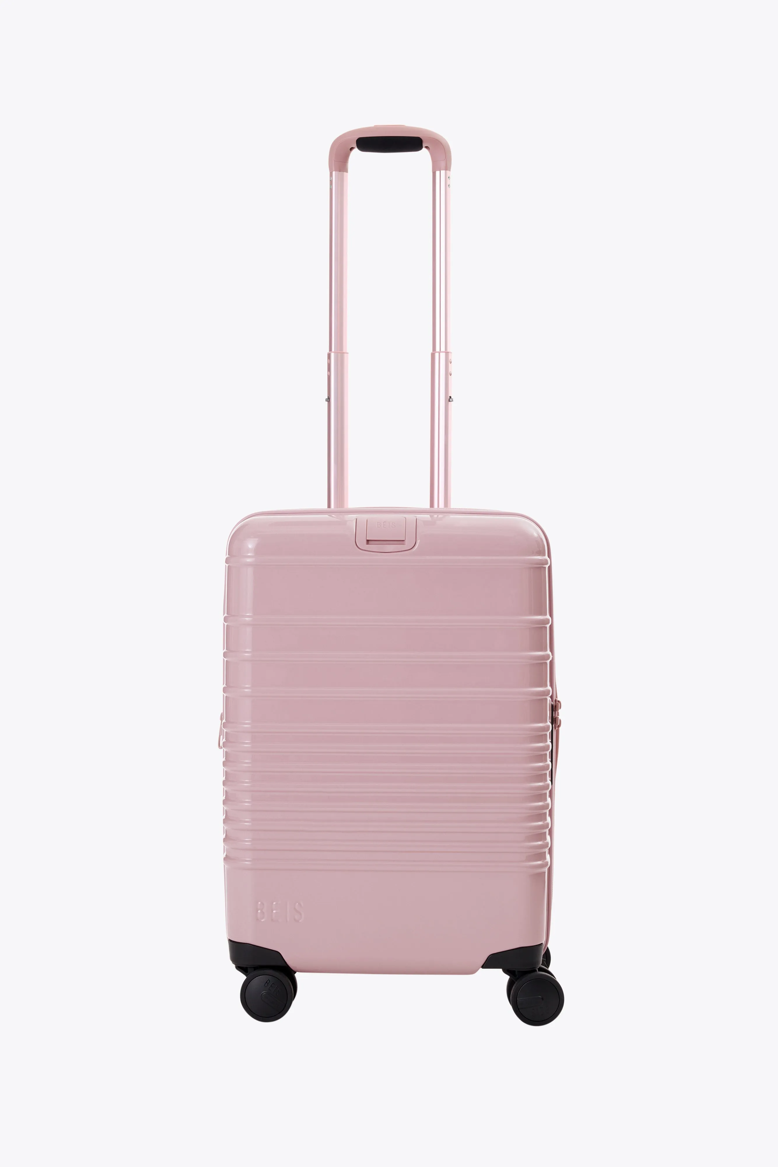 The Carry-On Roller in Glossy Atlas Pink sold by Beis