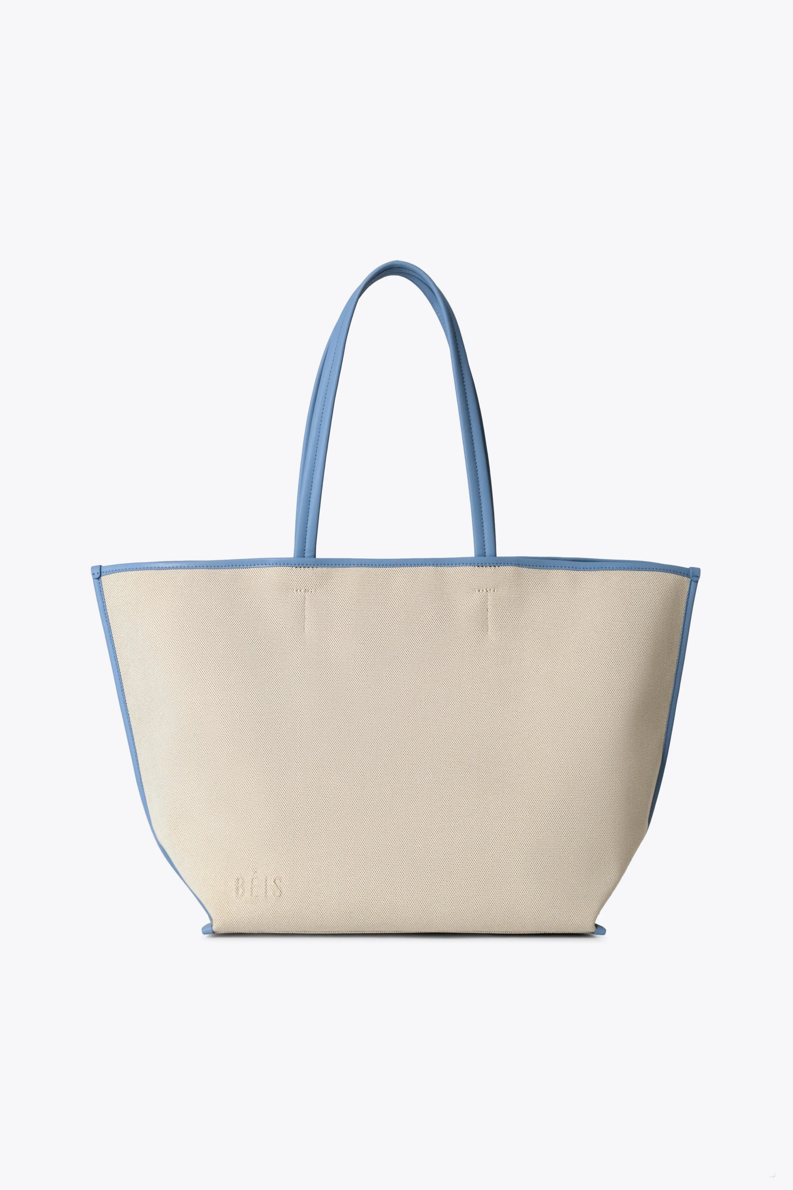 The Canvas and Leather Tote in Dusty Blue sold by Beis