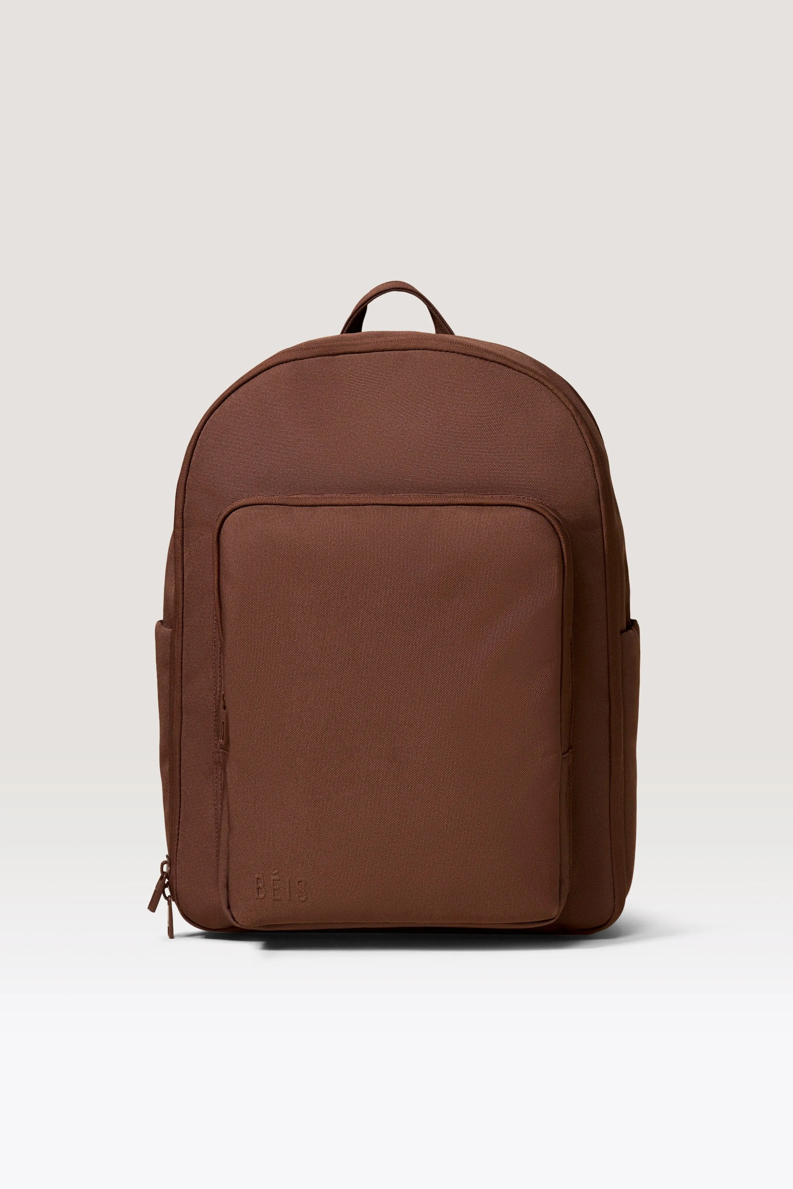 The Travel Backpack in Maple sold by Beis