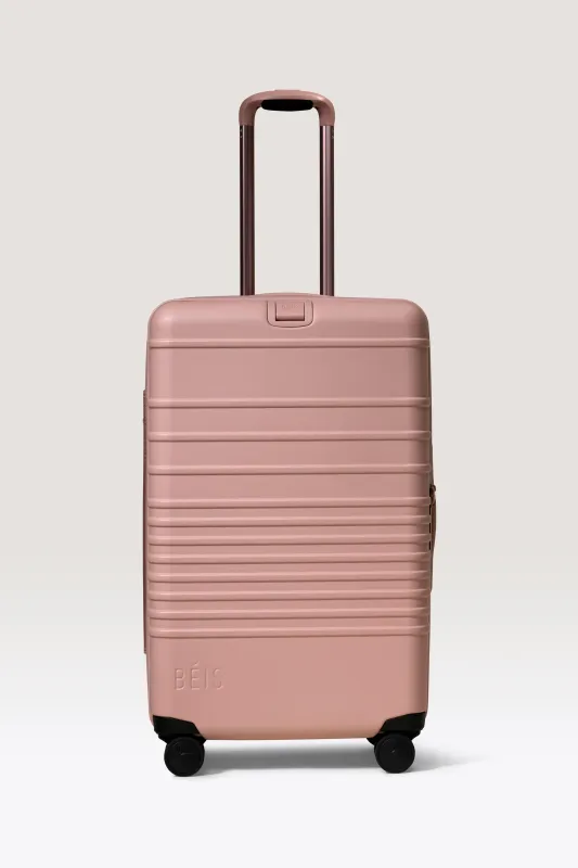 The Medium Check-In Roller in Atlas Pink made by Beis