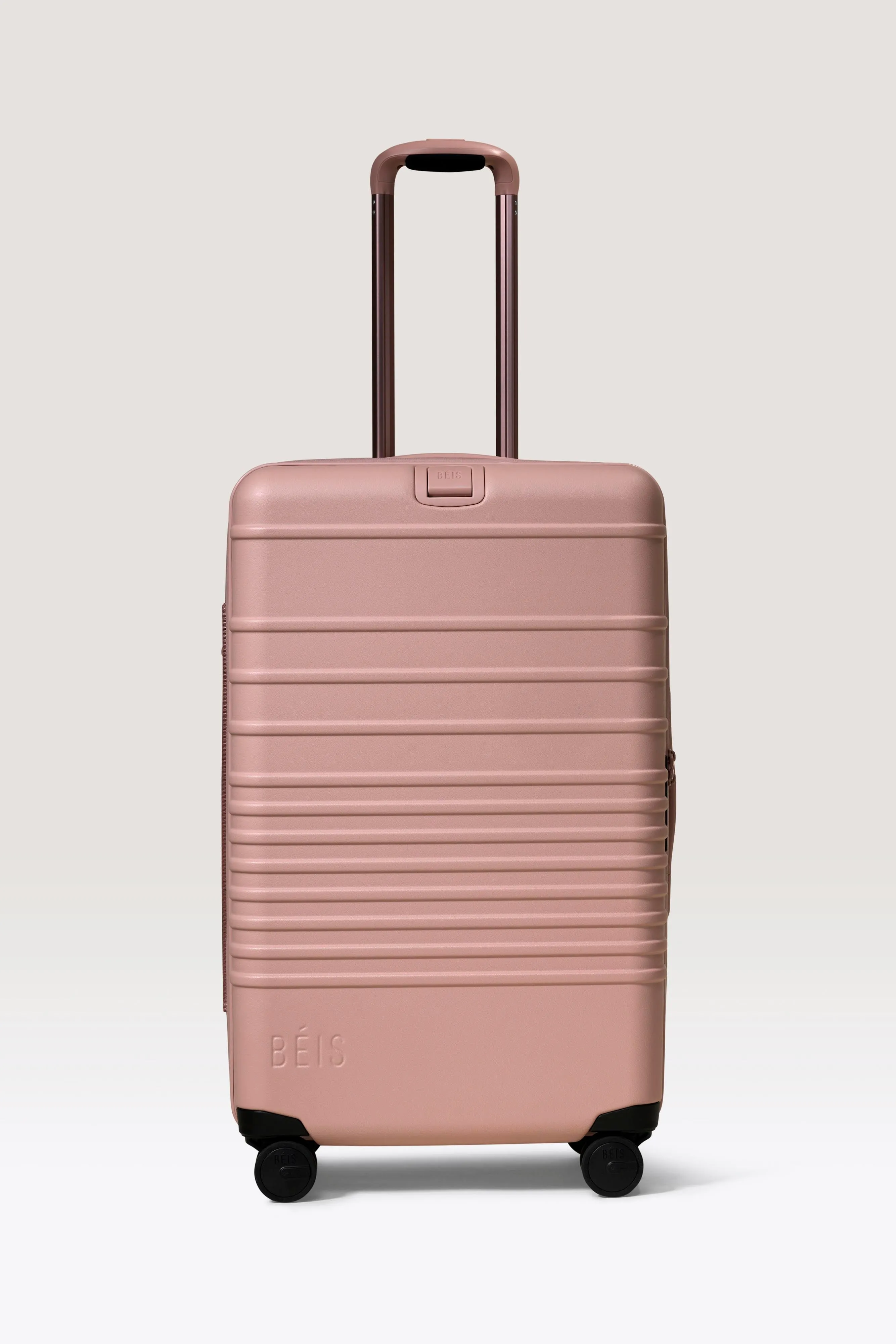 The Medium Check-In Roller in Atlas Pink sold by Beis
