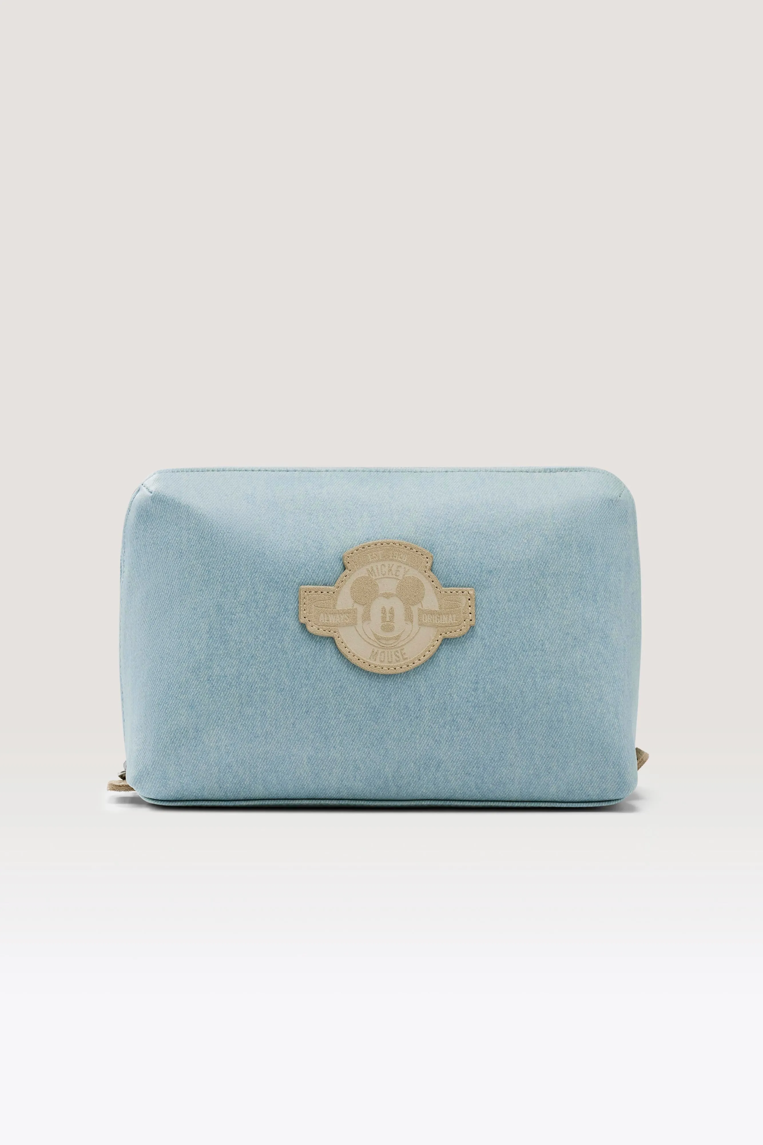 The Disney Medium Cosmetic Pouch in Blue Jeans sold by Beis