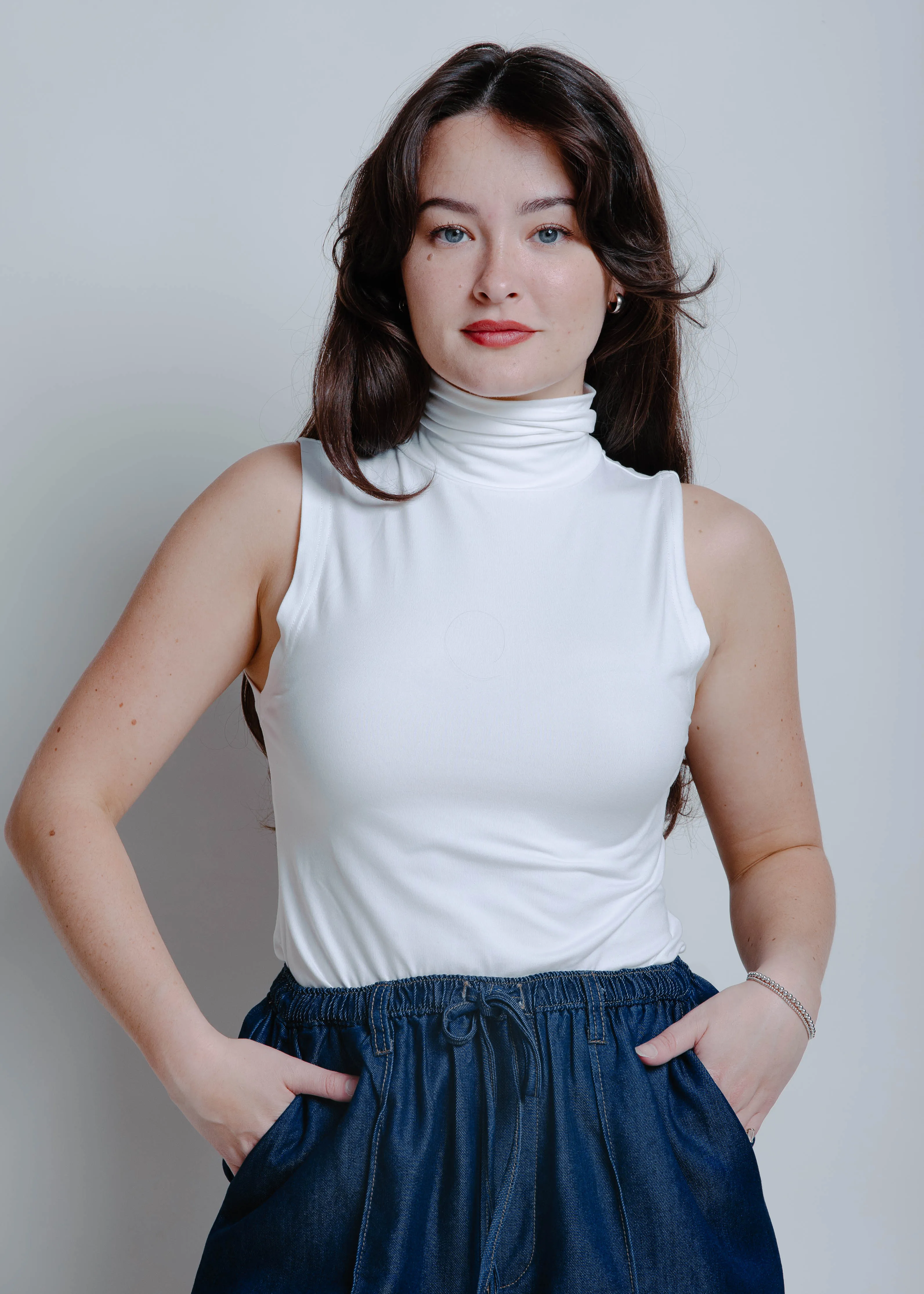 The Alaya Turtleneck Sleeveless Top - White sold by Vinnie Louise