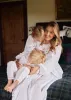 Samantha Varvel x Smock London Women's Nightingale Dress Moonstone White with Candy Cane Trim and Holly Hand Smocking sold by Smock London