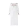 Samantha Varvel x Smock London Women's Nightingale Dress Moonstone White with Candy Cane Trim and Holly Hand Smocking sold by Smock London