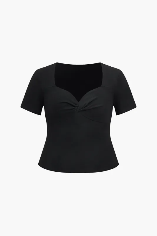 Plus størrelse solid twist knude t-shirt sold by Micas