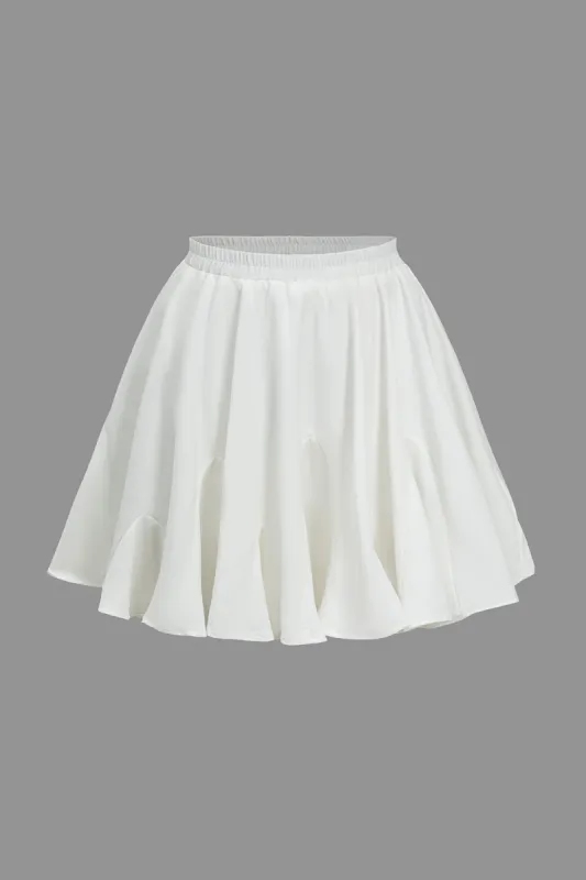 Solid ruffled mini nederdel sold by Micas