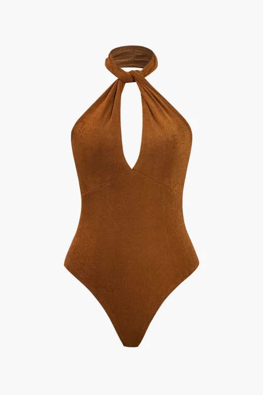 Solid Twist Knot Bodysuit sold by Micas