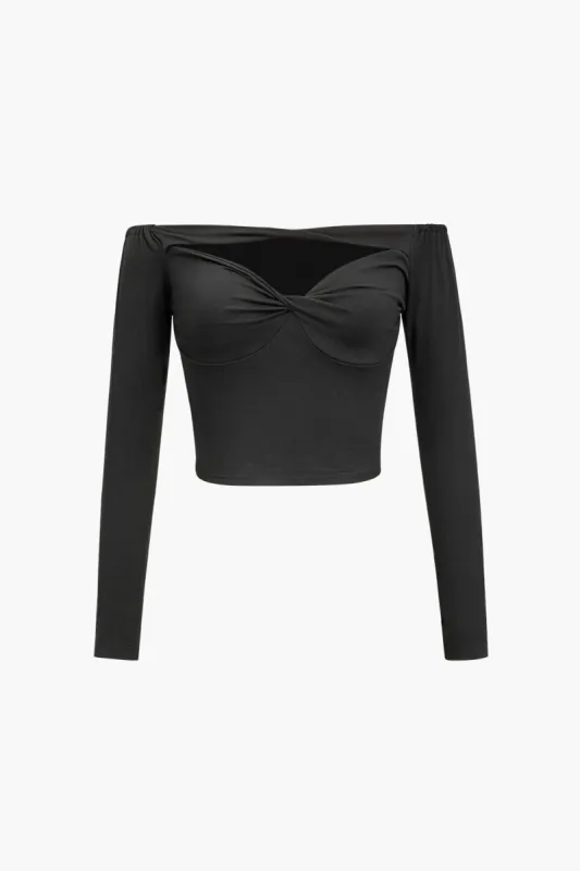 Solid strikket twist knude langærmet top sold by Micas