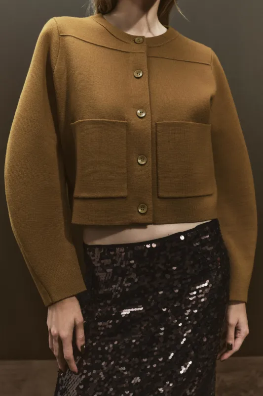 Solid Pocket Button Sweater Cardigan sold by Micas