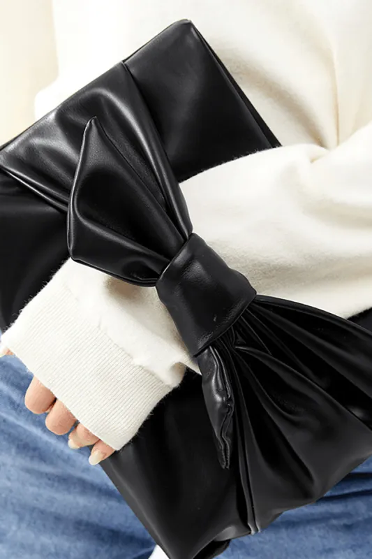 Leather Bow Clutch Bag sold by Micas