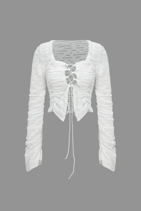 Solid Cut Out Tie Up Long-Sleeve Top sold by Micas
